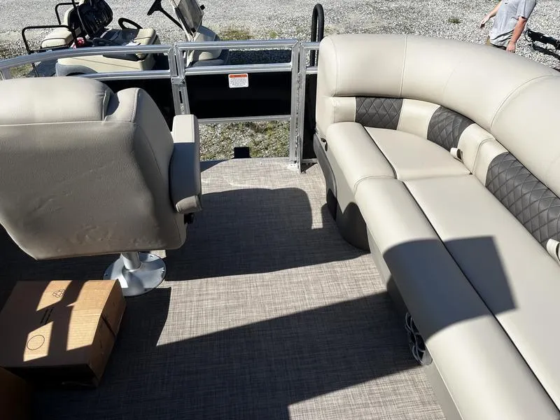 Slide: The Image of Interior of 2024 Sun Tracker SportFish 20 DLX pontoon boat with seating and captain's chair. - 3
