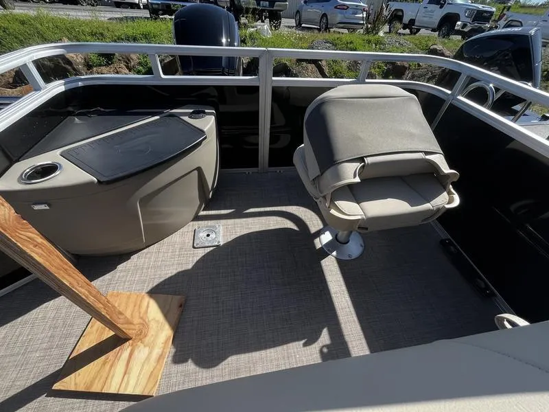 Slide: The Image of 2024 Sun Tracker SportFish 20 DLX boat interior with seating and storage. - 4