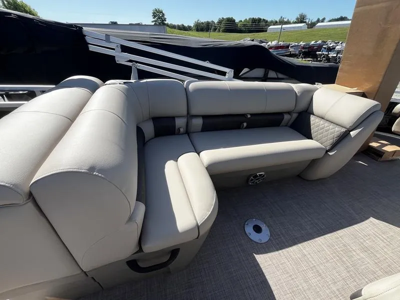 Slide: The Image of 2024 Sun Tracker SportFish 20 DLX pontoon boat with comfortable seating. - 5