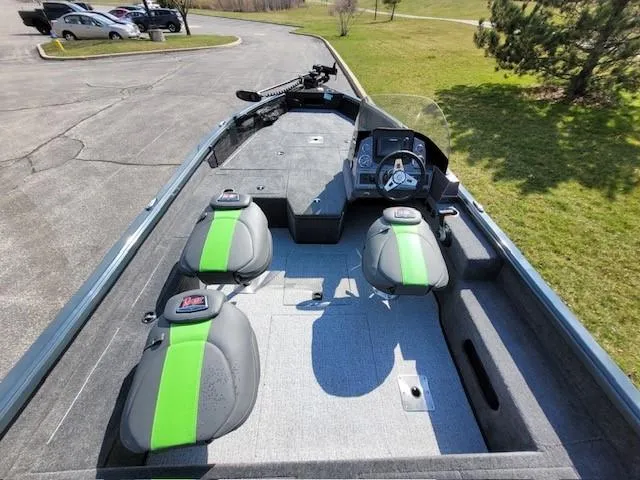 Slide: The Image of 2024 Ranger VS1782SC Angler boat interior with green-accented seats and steering console. - 3