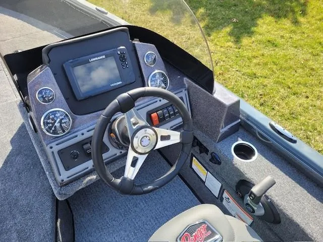 Slide: The Image of 2024 Ranger VS1782SC Angler boat dashboard with steering wheel and navigation system. - 5