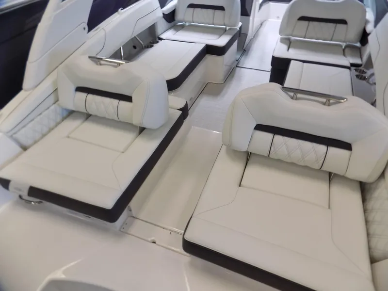 Slide: The Image of Luxurious seating in 2024 Regal LX2 boat, featuring elegant white upholstery and modern design. - 10