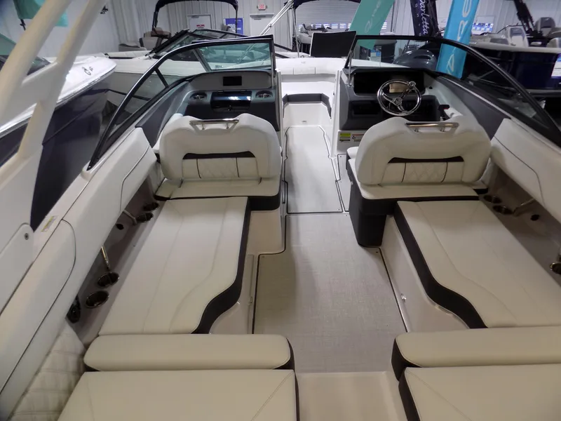 Slide: The Image of 2024 Regal LX2 boat interior with luxurious seating and modern dashboard design. - 2