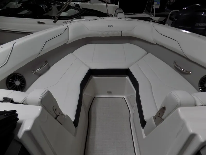 Slide: The Image of 2024 Regal LX2 boat interior with white seating and sleek design. - 3