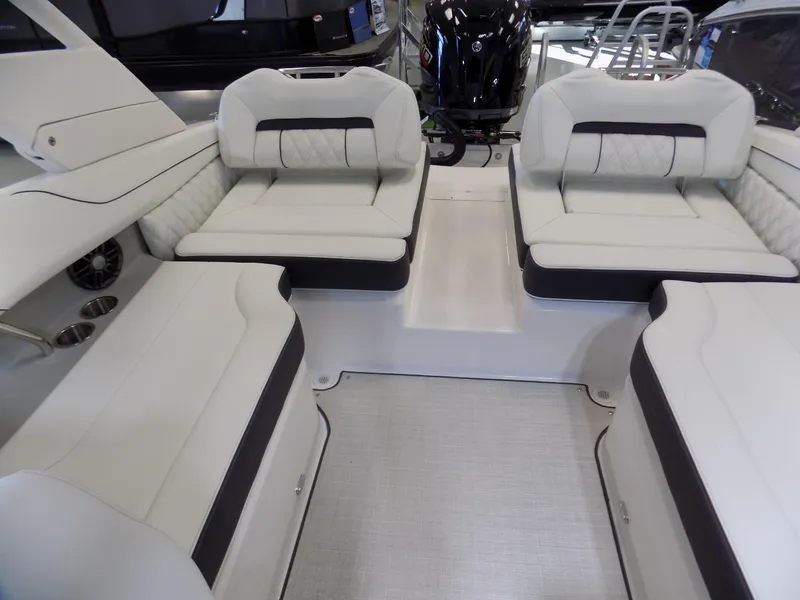 Slide: The Image of 2024 Regal LX2 boat interior with white cushioned seating and modern design. - 7