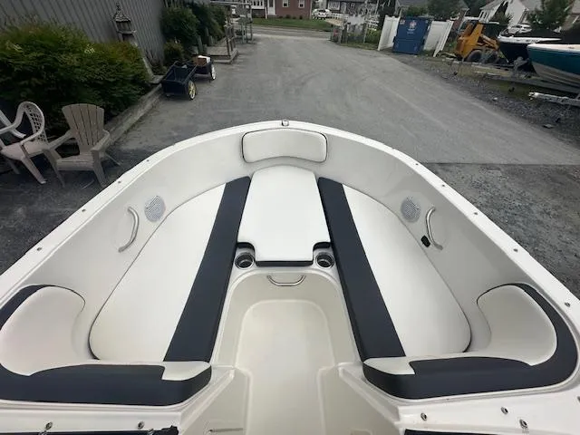 Slide: The Image of 2022 Bayliner VR4 Bowrider OB interior with white and black seating. - 11