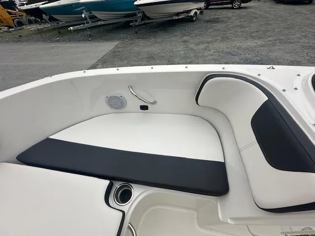 Slide: The Image of 2022 Bayliner VR4 Bowrider OB interior seating with black and white cushions. - 13