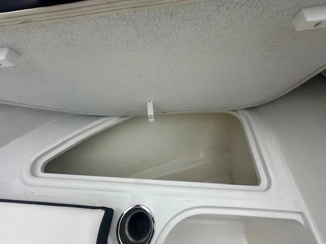 Slide: The Image of 2022 Bayliner VR4 Bowrider OB storage compartment with open lid. - 14