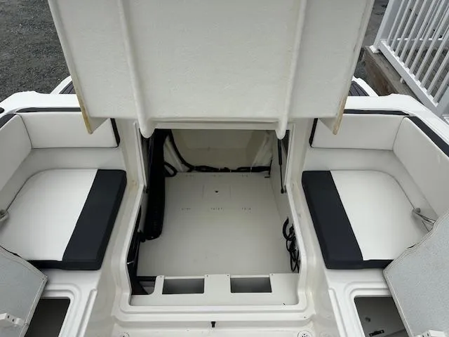 Slide: The Image of 2022 Bayliner VR4 Bowrider OB open storage compartment with seating. - 18