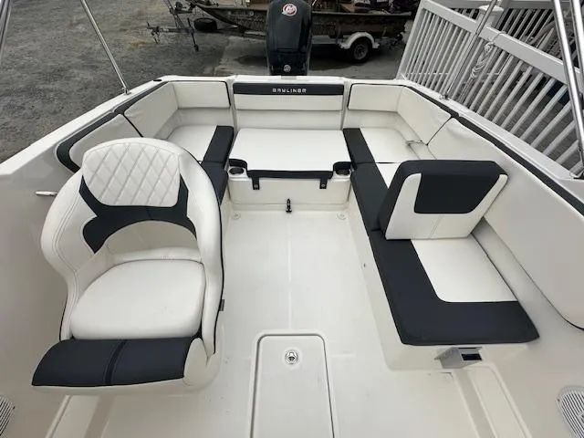 Slide: The Image of 2022 Bayliner VR4 Bowrider OB interior with white and black seating. - 19