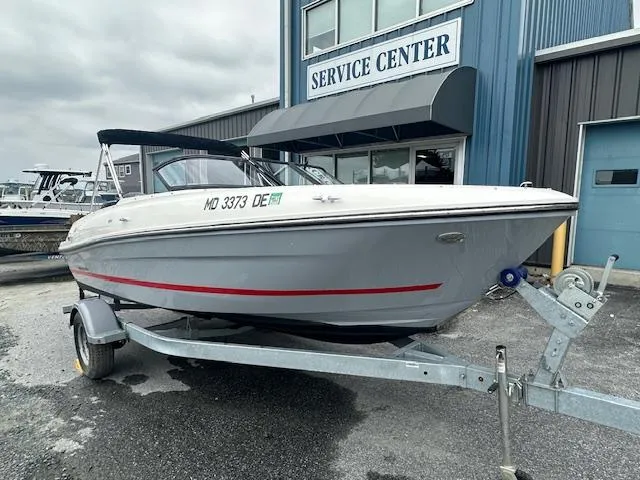 Slide: The Image of 2022 Bayliner VR4 Bowrider OB on trailer outside service center. - 2