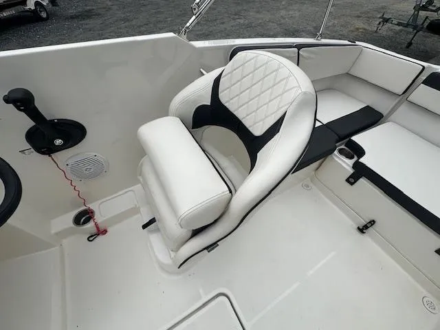 Slide: The Image of 2022 Bayliner VR4 Bowrider OB interior with white and black seating. - 20