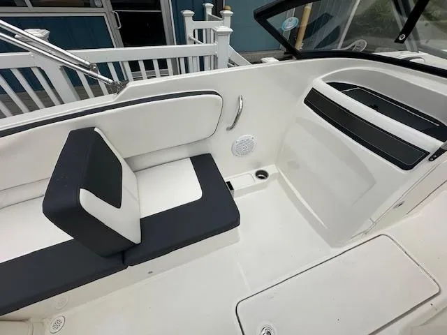 Slide: The Image of 2022 Bayliner VR4 Bowrider OB interior seating and dashboard. - 22