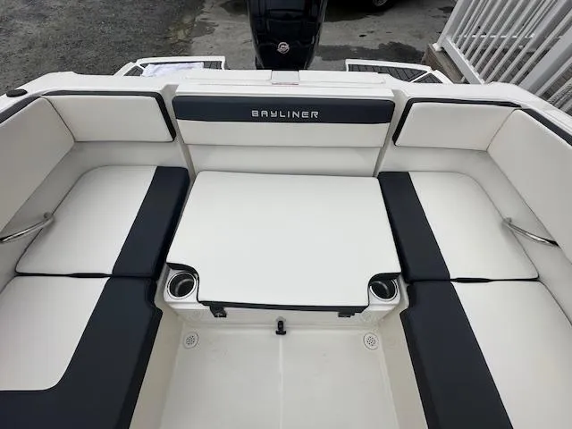 Slide: The Image of 2022 Bayliner VR4 Bowrider OB boat interior with cushioned seating and cup holders. - 23