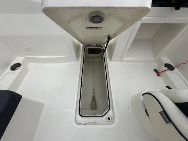 Slide: The Image of 2022 Bayliner VR4 Bowrider OB storage compartment and seating area. - 26