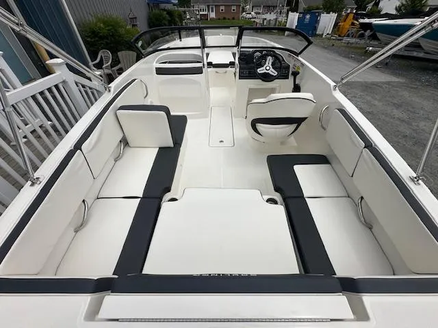 Slide: The Image of 2022 Bayliner VR4 Bowrider OB interior with spacious seating and modern dashboard. - 29