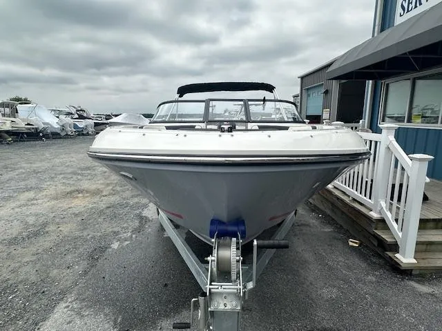 Slide: The Image of 2022 Bayliner VR4 Bowrider OB on trailer, front view, overcast sky. - 8