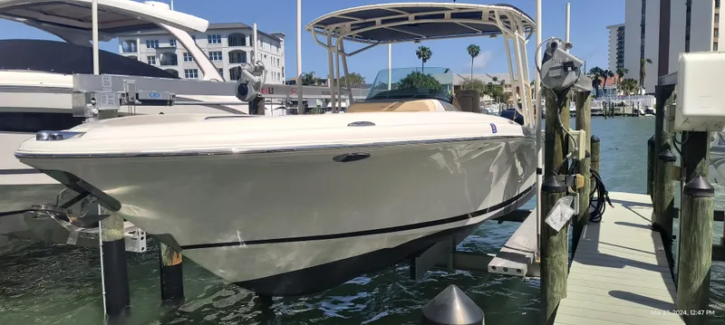 Slide: The Image of 2015 Chris-Craft Catalina 29 boat docked at a marina. - 0