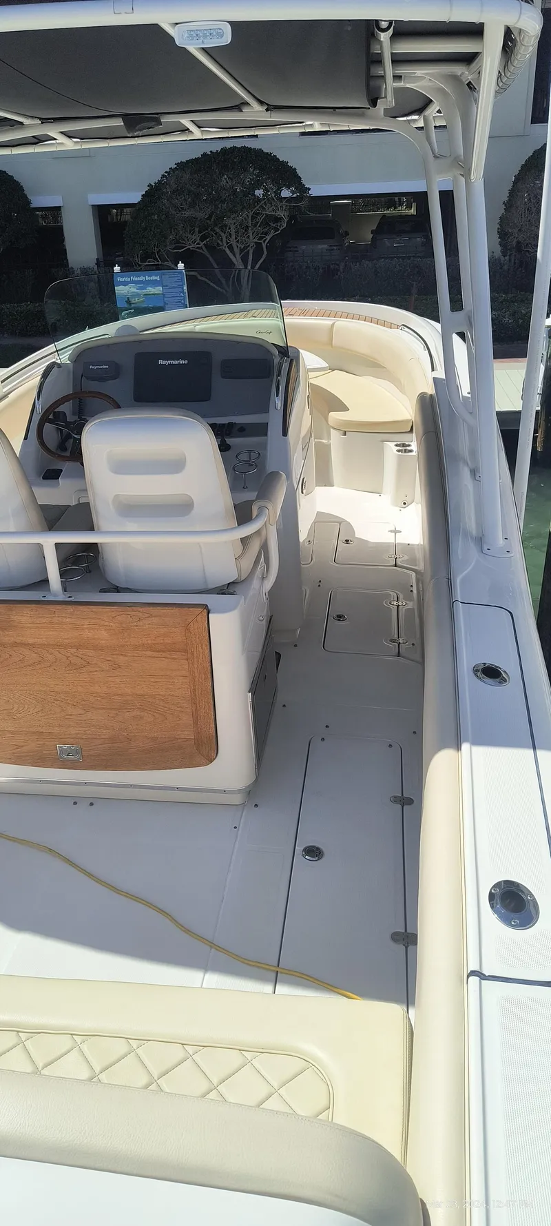 Slide: The Image of 2015 Chris-Craft Catalina 29 boat interior with helm and seating. - 10