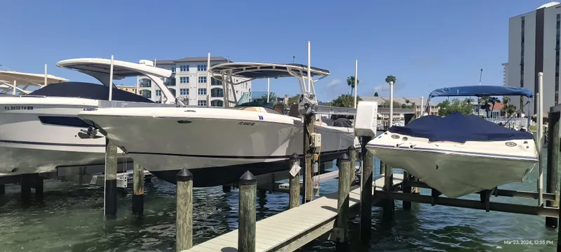 Slide: The Image of Chris-Craft Catalina 29 (2015) docked at a marina with other boats. - 12