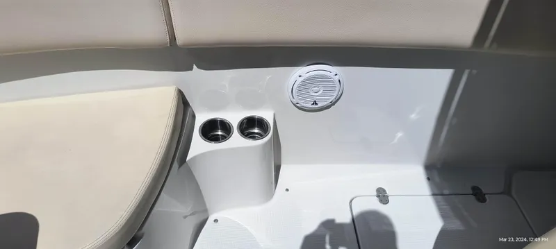 Slide: The Image of 2015 Chris-Craft Catalina 29 interior with cup holders and speaker. - 27