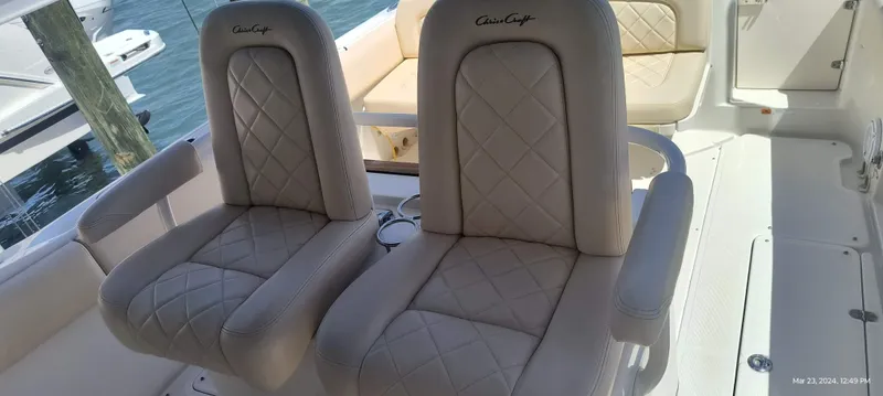 Slide: The Image of 2015 Chris-Craft Catalina 29 boat with luxurious beige seating. - 35