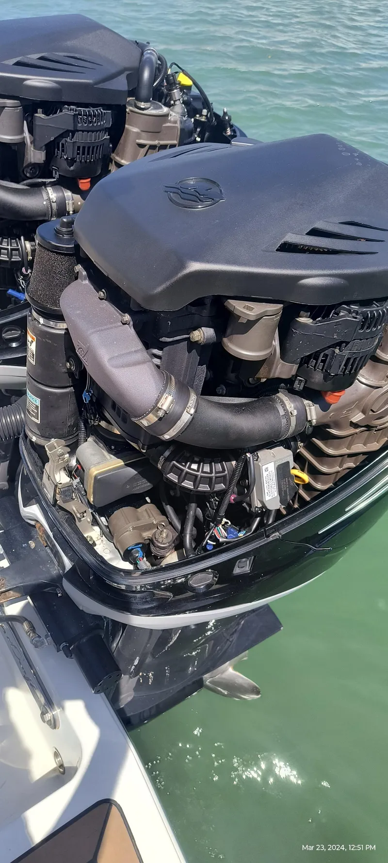 Slide: The Image of Close-up of 2015 Chris-Craft Catalina 29 outboard engines on water. - 37