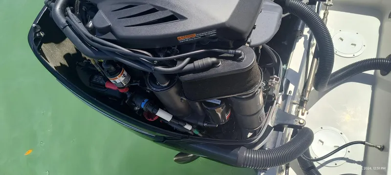 Slide: The Image of 2015 Chris-Craft Catalina 29 engine close-up in water. - 38