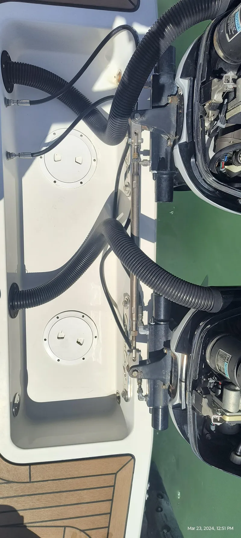 Slide: The Image of 2015 Chris-Craft Catalina 29 boat engine compartment with visible wiring and components. - 39