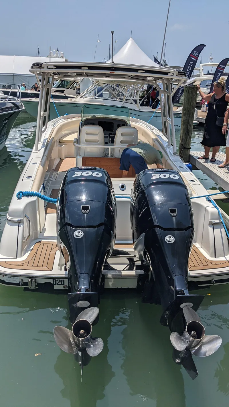 Slide: The Image of 2015 Chris-Craft Catalina 29 with twin 200 HP engines docked at a marina. - 41