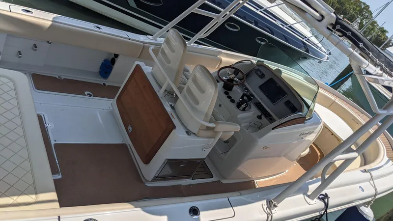 Slide: The Image of 2015 Chris-Craft Catalina 29 boat interior with helm and seating. - 43
