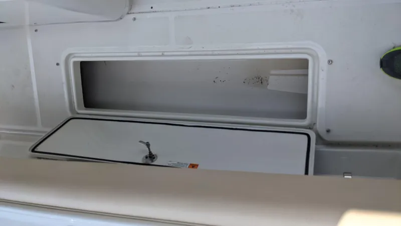 Slide: The Image of 2015 Chris-Craft Catalina 29 storage compartment with open hatch. - 46