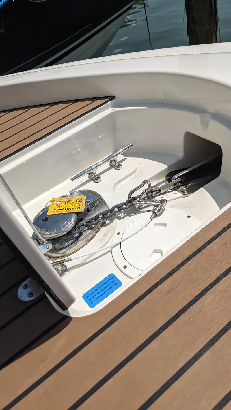 Slide: The Image of 2015 Chris-Craft Catalina 29 anchor locker with chain and windlass. - 47