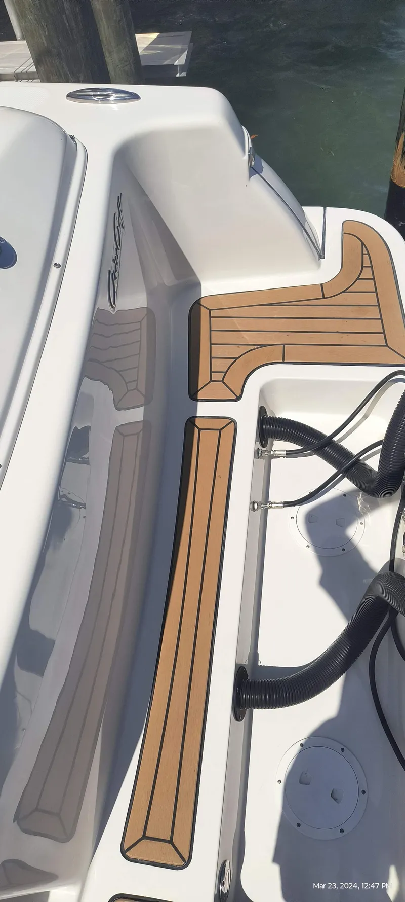 Slide: The Image of 2015 Chris-Craft Catalina 29 boat deck with teak flooring. - 8