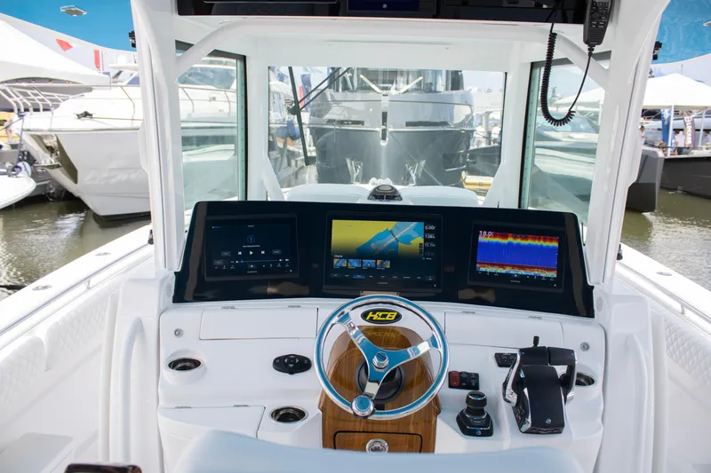 Slide: The Image of 2024 HCB 42 Lujo boat helm with advanced navigation displays. - 10
