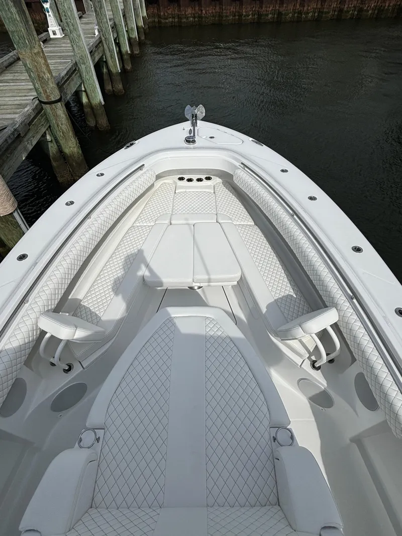 Slide: The Image of 2024 HCB 42 Lujo boat with luxurious white seating and sleek design. - 17