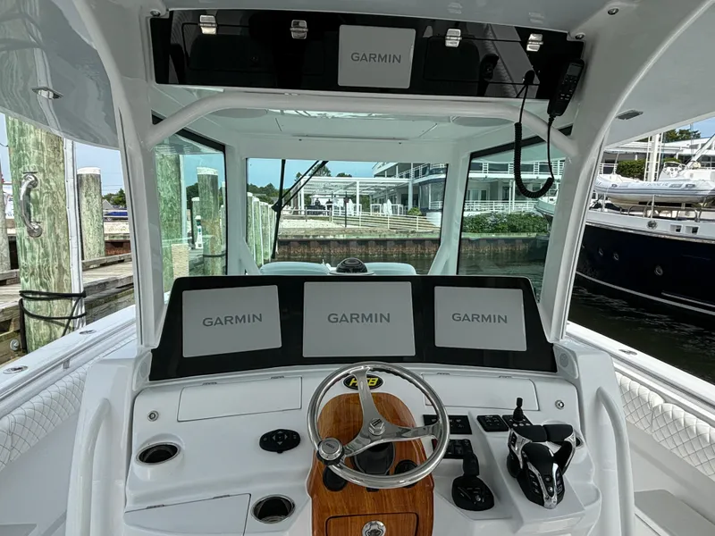 Slide: The Image of 2024 HCB 42 Lujo boat helm with Garmin navigation screens. - 21