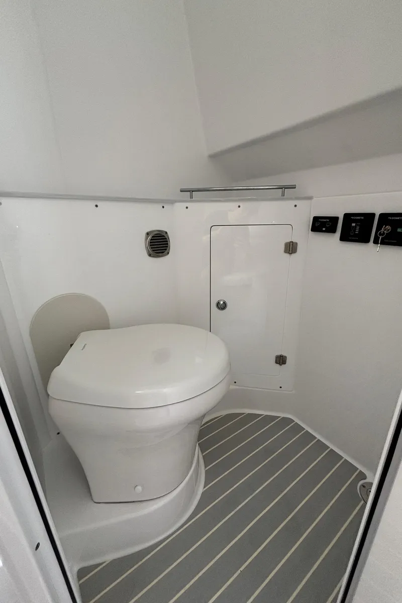 Slide: The Image of 2024 HCB 42 Lujo boat bathroom with modern toilet and storage. - 26