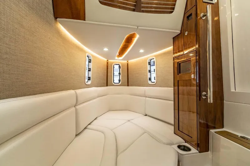 Slide: The Image of Luxurious interior cabin of the 2024 HCB 42 Lujo boat with plush seating and elegant wood finishes. - 5