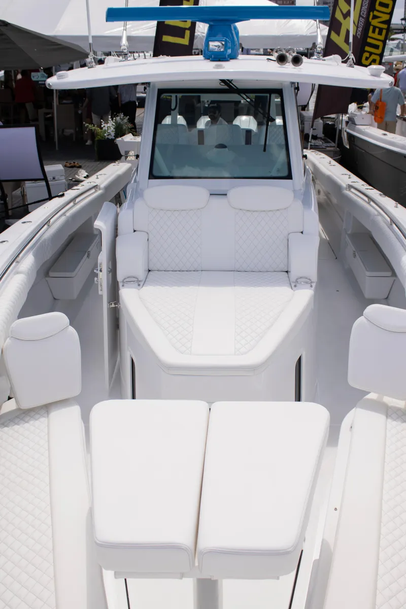 Slide: The Image of 2024 HCB 42 Lujo luxury boat with white seating and modern design. - 8