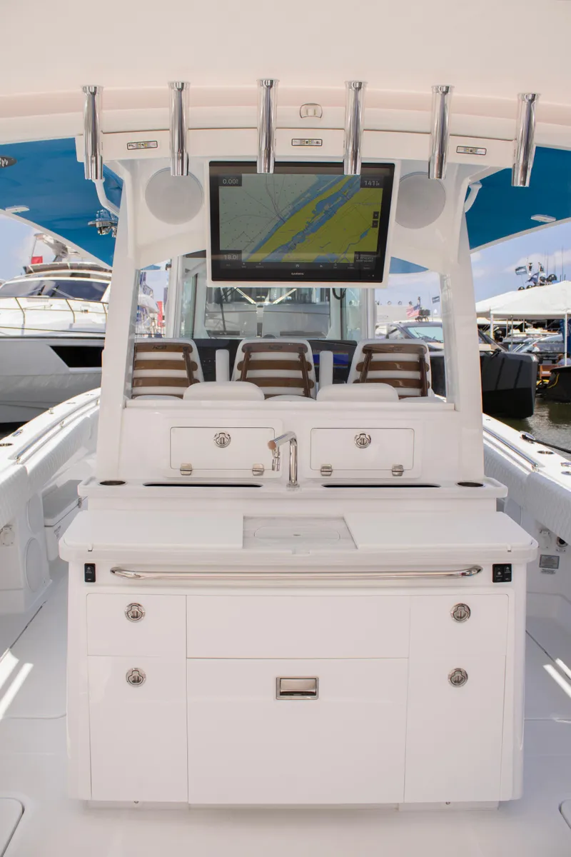 Slide: The Image of 2024 HCB 42 Lujo luxury boat interior with seating and navigation screen. - 9