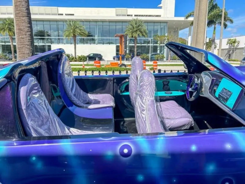 Slide: The Image of 2023 Watersports Car Series B with open-top design and futuristic interior. - 3