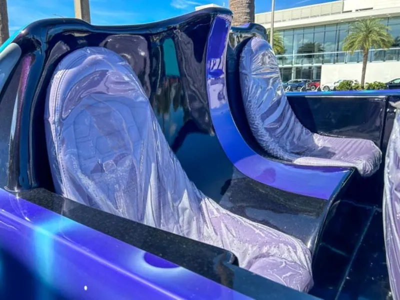 Slide: The Image of 2023 Watersports Car Series B interior with sleek, futuristic design and purple seats. - 5