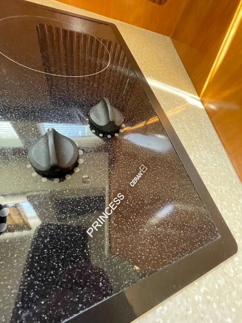 Slide: The Image of Close-up of Princess ceramic stovetop on 2002 Carver 444 Cockpit Motoryacht. - 29