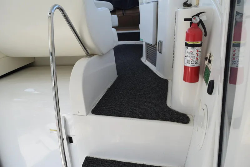 Slide: The Image of Interior steps of a 2002 Carver 444 Cockpit Motoryacht with fire extinguisher. - 9
