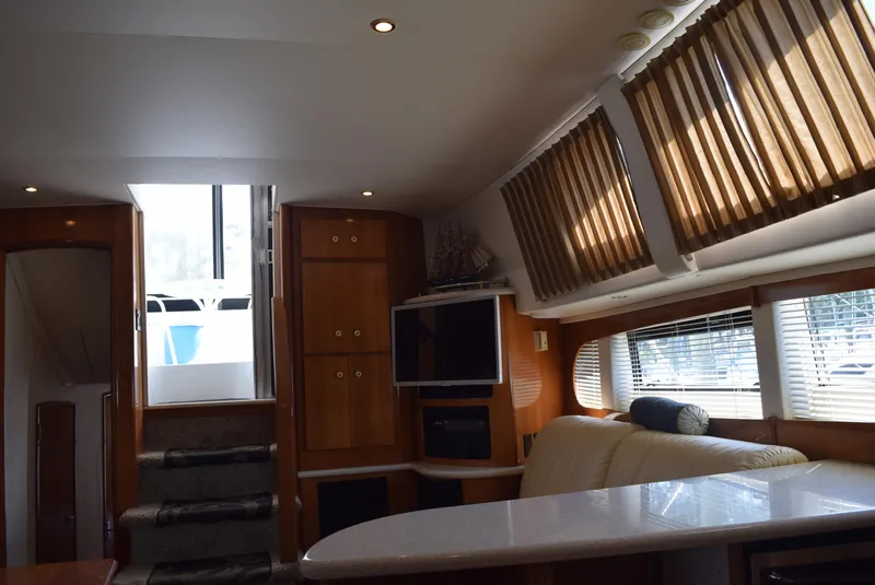 Slide: The Image of Interior of 2002 Carver 444 Cockpit Motoryacht with modern furnishings and natural light. - 20