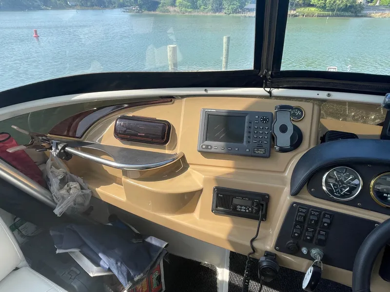 Slide: The Image of Helm of a 2002 Carver 444 Cockpit Motoryacht with navigation equipment. - 27