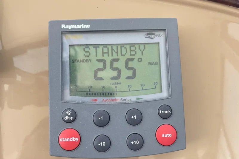 Slide: The Image of Raymarine autopilot display on 2002 Carver 444 Cockpit Motoryacht showing standby mode. - 35