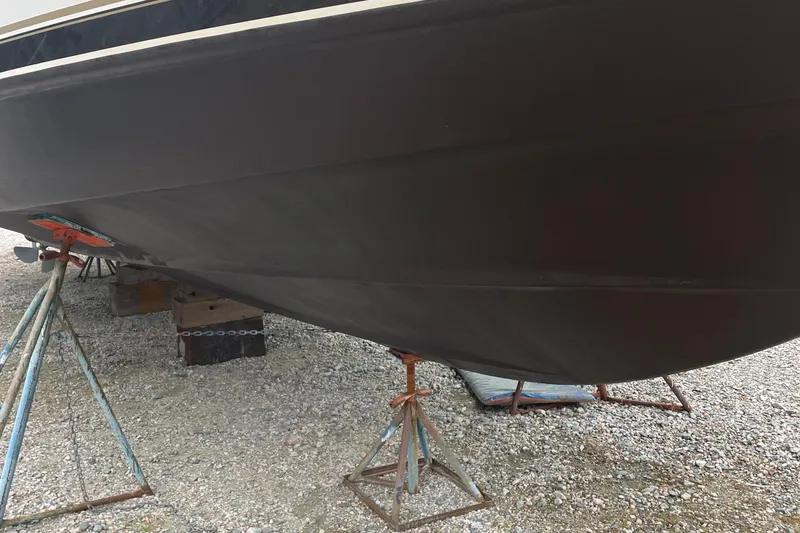 Slide: The Image of 2002 Carver 444 Cockpit Motoryacht on stands for maintenance. - 41