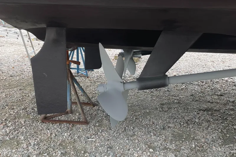 Slide: The Image of 2002 Carver 444 Cockpit Motoryacht propeller and rudder on dry dock. - 42